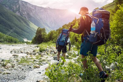 Guided hikers on a trail near Glenorchy surrounded by mountains