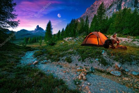 Small wilderness camp with a tent set in alpine terrain above Glenorchy